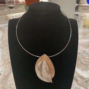 Unique gold and silver pendant